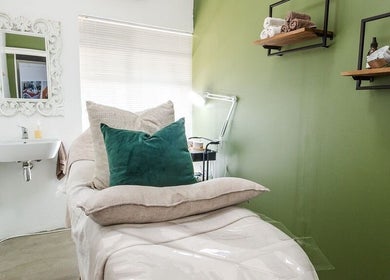 Tranquil treatment room at Perfectly Beautiful in Bloemfontein, Free State, ZA with plush bed and elegant decor.