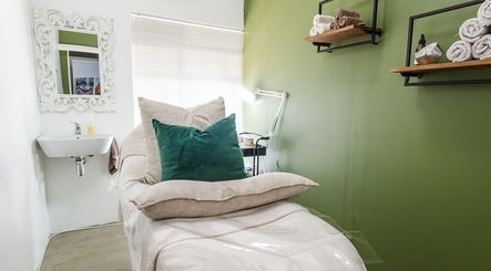Relaxing treatment room at Perfectly Beautiful, Bloemfontein, Free State, ZA, with plush bed and elegant decor.