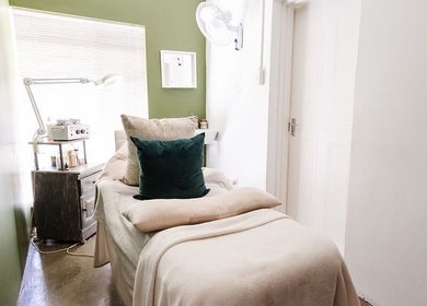 Calming treatment room at Perfectly Beautiful, Bloemfontein, Free State, ZA with cozy bed and soft lighting.