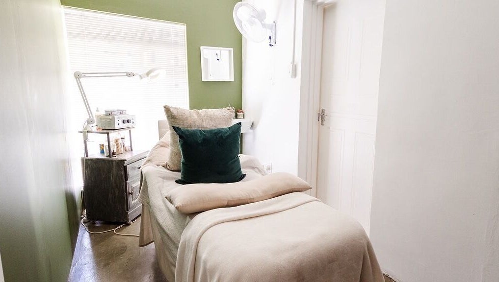 Cozy treatment room at Perfectly Beautiful, Bloemfontein, Free State, ZA with plush bedding and ambient lighting.