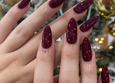 Stylish maroon nails showcased at Prosperity Nails & Beauty in North Melbourne, Victoria, AU.