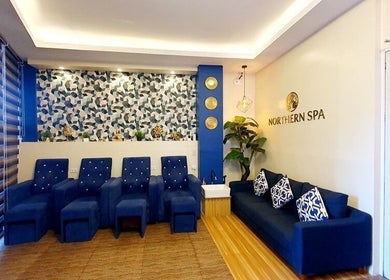 Luxe seating area at Northern Spa - Cabanatuan City, Central Luzon, PH, featuring modern decor and plush chairs.