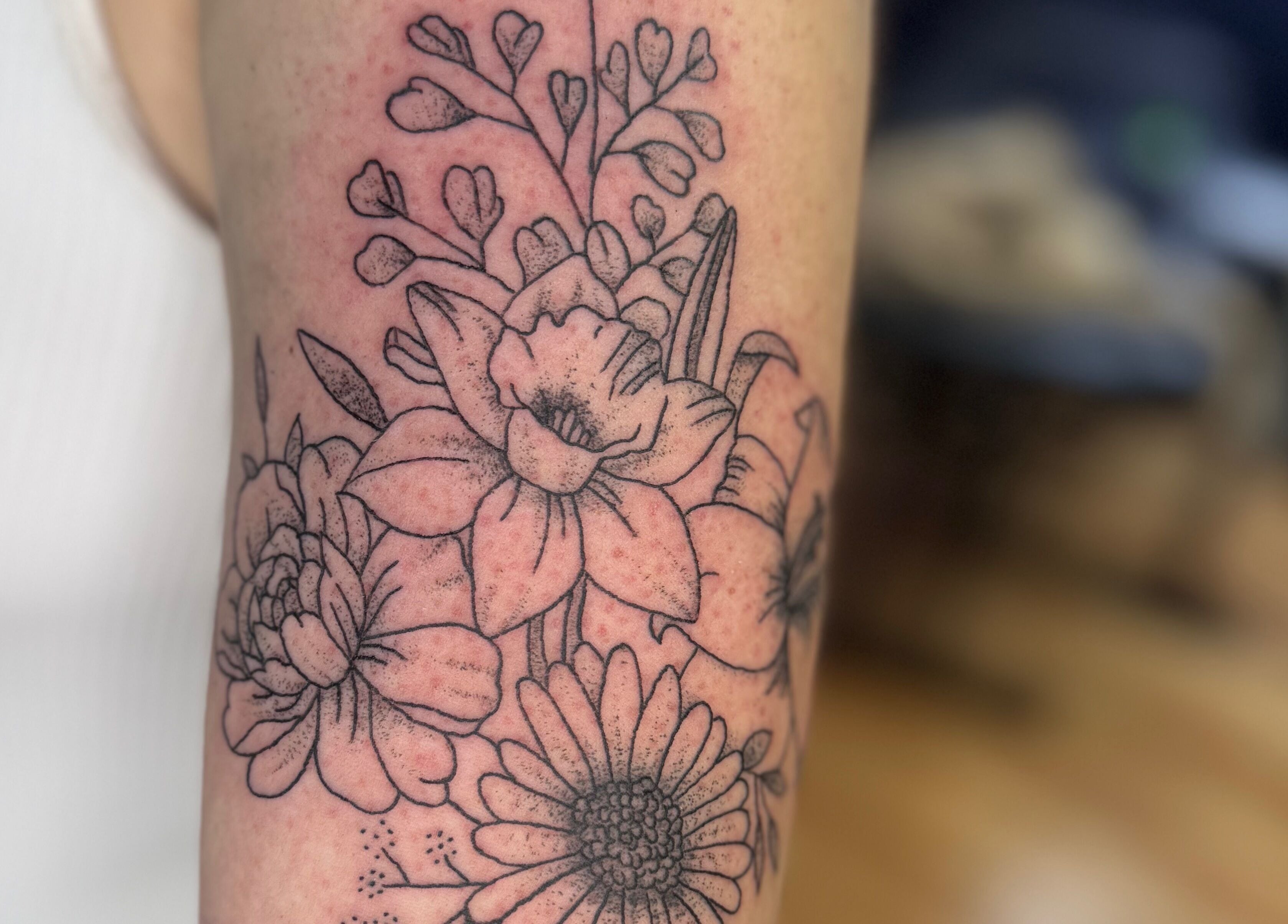 Exquisite floral tattoo artwork from Asatru Tattoos in Cardiff, Wales, GB. Showcasing delicate flower designs.