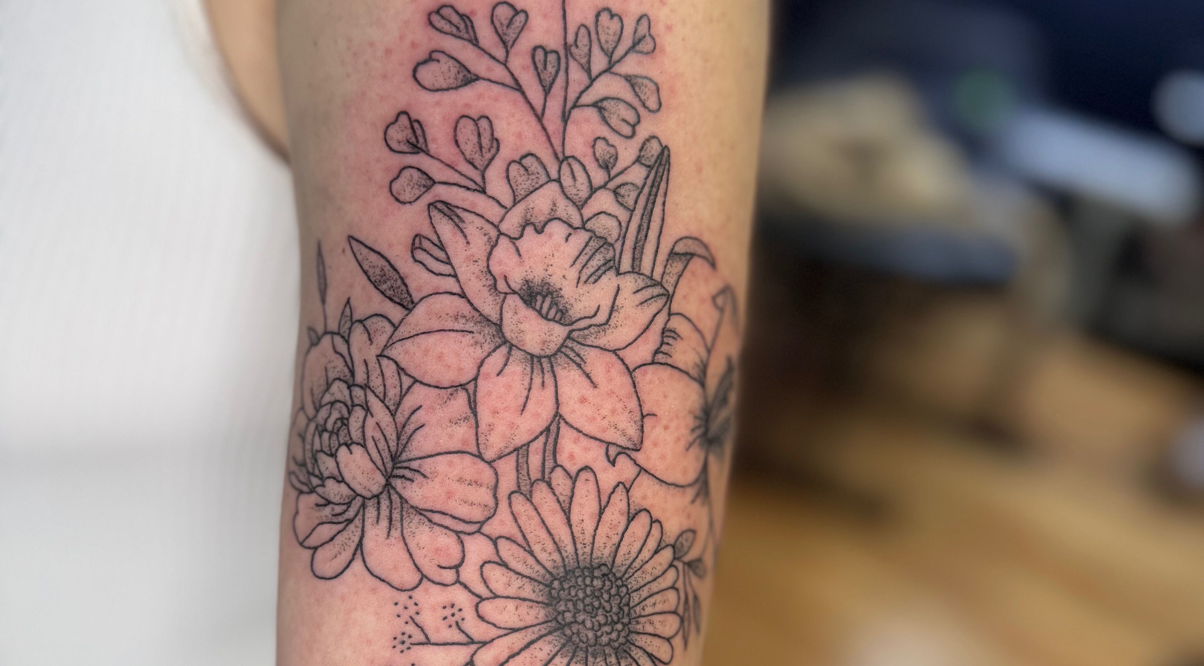 Exquisite floral tattoo artwork from Asatru Tattoos in Cardiff, Wales, GB. Showcasing delicate flower designs.