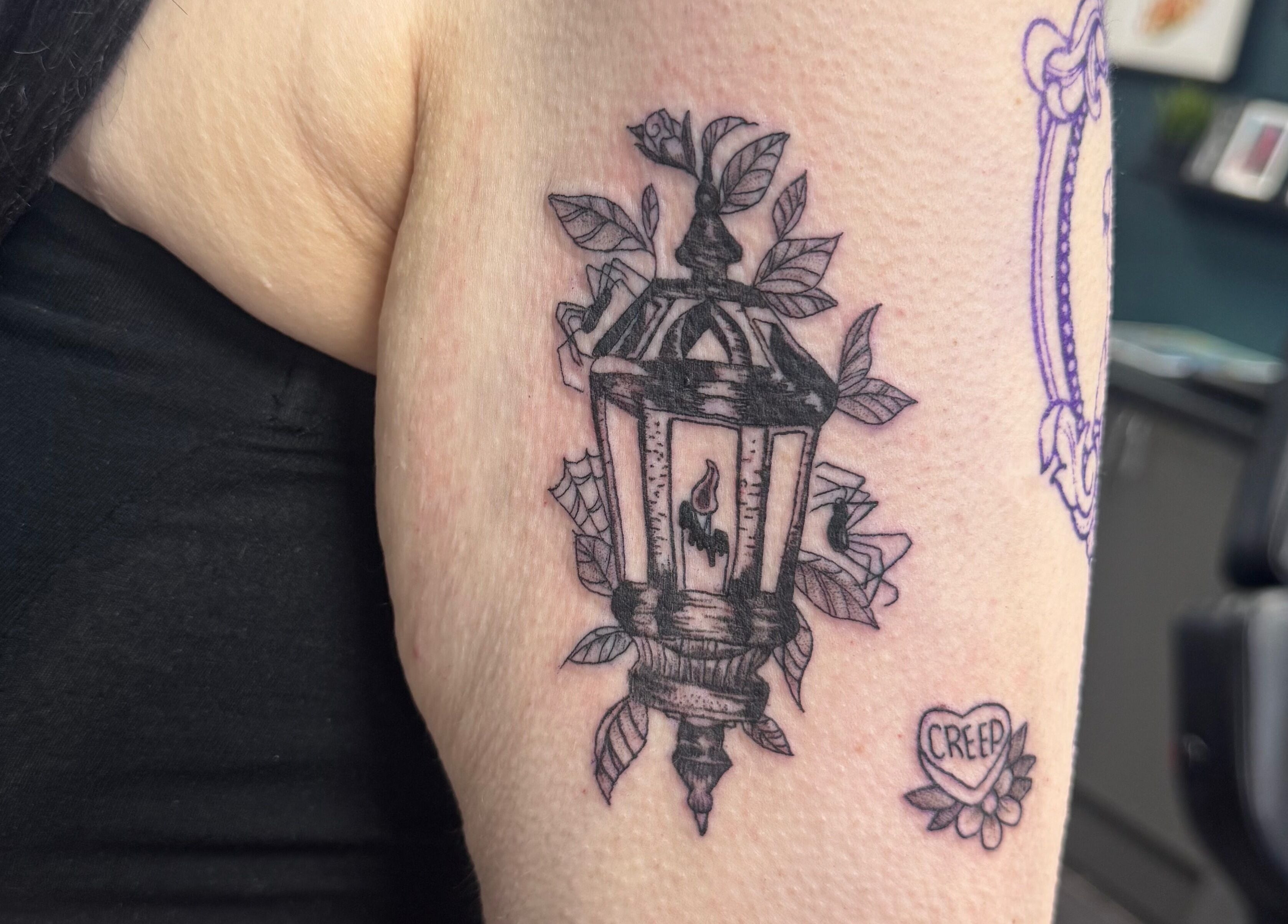 Lantern tattoo design at Asatru Tattoos, Cardiff, Wales, GB showcasing intricate black ink detail.