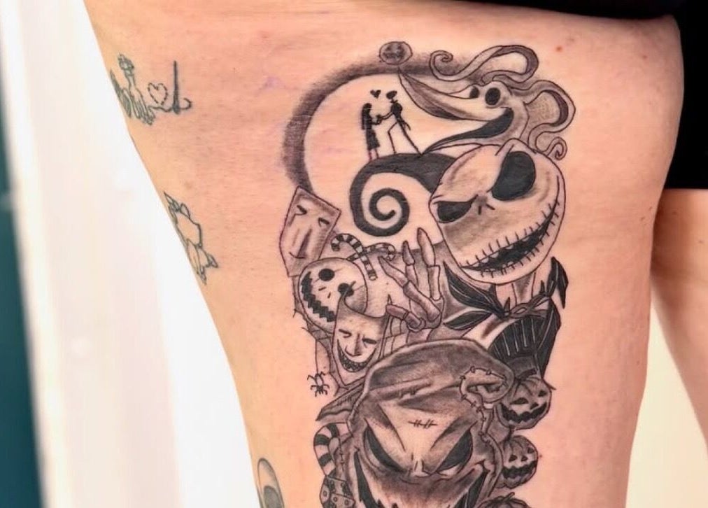 Detailed leg tattoo design at Asatru Tattoos, Cardiff, Wales, GB showcasing intricate black ink work.