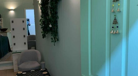 Relaxing interior at Jane Sandford at Looe Wellness Centre, Looe, England, GB featuring calming green decor.