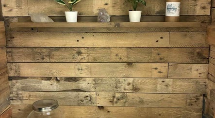 Rustic wooden shelves with crystals at Jane Sandford Hypnotherapy and Holistic Health in Liskeard, England, GB.