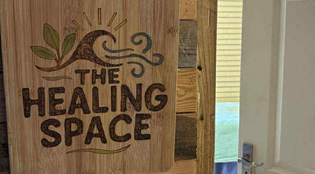 Rustic sign saying The Healing Space at Jane Sandford Hypnotherapy and Holistic Health, Liskeard, England, GB.