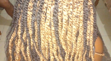 Intricate braided hairstyle at Nash&Zeco's all in one business's, Roseau, Saint George Parish, DM.