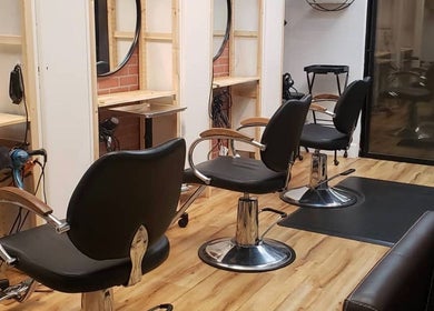 Modern salon chairs at Chemically Dependent, Chandler, Arizona, US, offering premium beauty services.