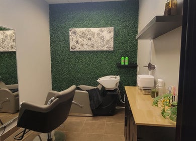 Modern salon suite at Chemically Dependent in Chandler, Arizona, US featuring stylish decor and a wash station.