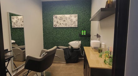 Modern salon suite at Chemically Dependent in Chandler, Arizona, US featuring stylish decor and a wash station.