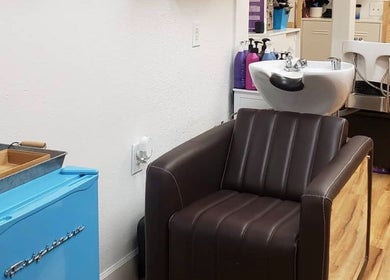 Luxurious salon chair and wash station at Chemically Dependent in Chandler, Arizona, US.