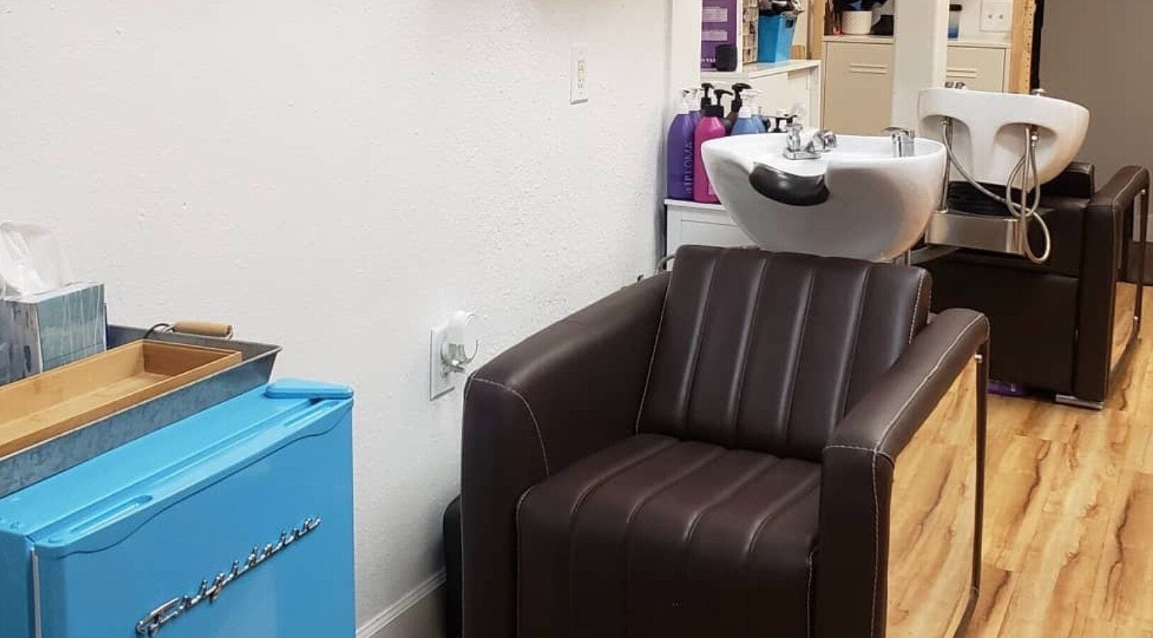 Luxurious salon chair and wash station at Chemically Dependent in Chandler, Arizona, US.