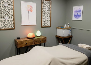 Calming massage room at The Bodhi Tree in Lancaster, New York, US with soft lighting and tranquil decor.