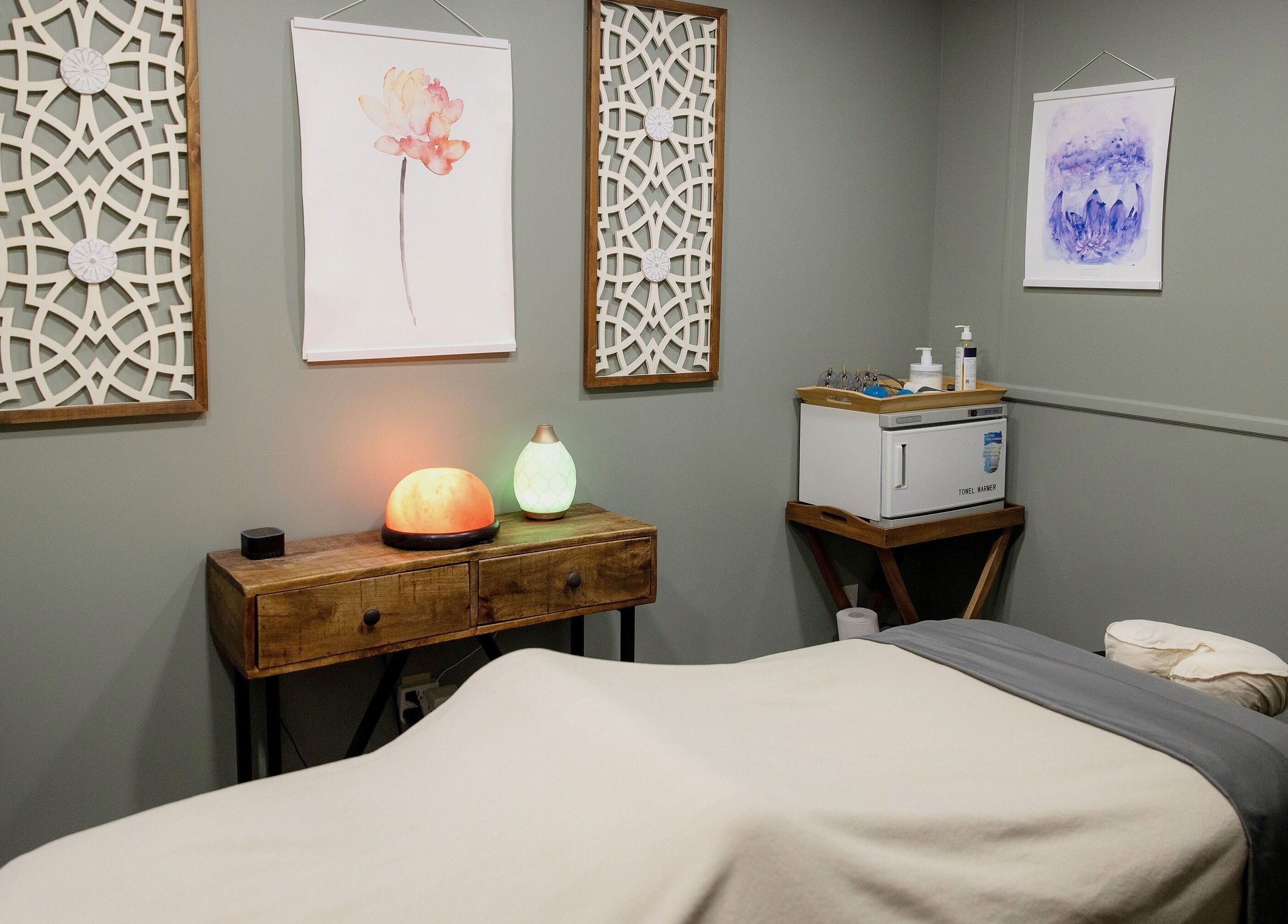 Calming massage room at The Bodhi Tree in Lancaster, New York, US with soft lighting and tranquil decor.