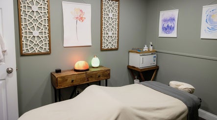 Calming massage room at The Bodhi Tree in Lancaster, New York, US with soft lighting and tranquil decor.