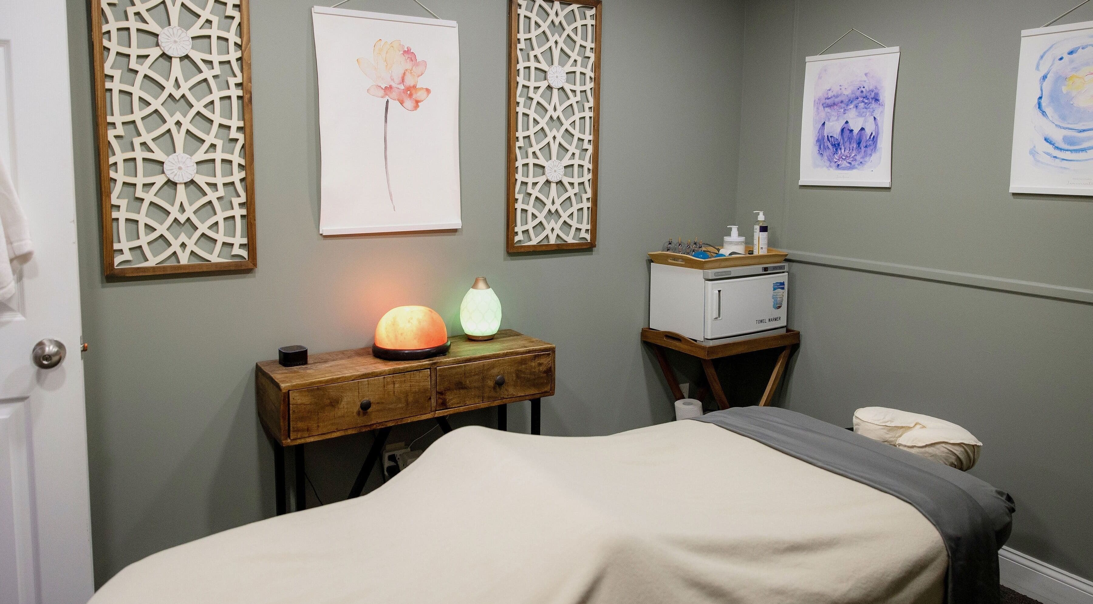 Calming massage room at The Bodhi Tree in Lancaster, New York, US with soft lighting and tranquil decor.