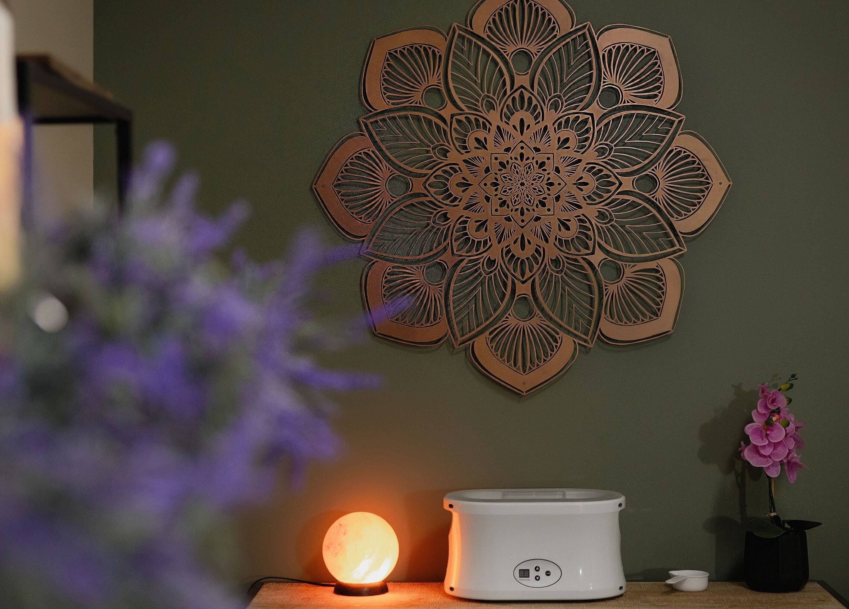 The Bodhi Tree in Lancaster, New York features intricate wall decor and calming spa ambience.