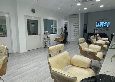 Interior of Ann Shane Hair Beauty Salon in Petaling Jaya, Selangor, MY featuring modern chairs and serene atmosphere.