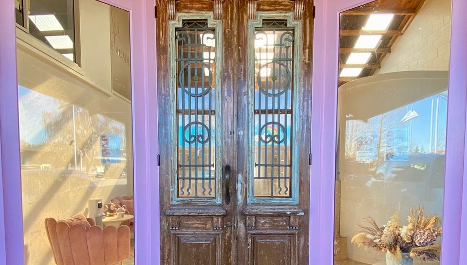 Charming double doors at ALPENGLOW BEAUTY THERAPY in Methven, Canterbury Region, NZ, welcoming guests inside.