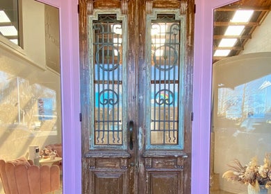 Charming double doors at ALPENGLOW BEAUTY THERAPY in Methven, Canterbury Region, NZ, welcoming guests inside.