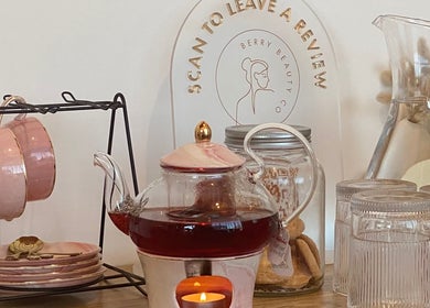 Tea setup with pink cups at ALPENGLOW BEAUTY THERAPY, Methven, Canterbury Region, NZ, creating a serene ambiance.
