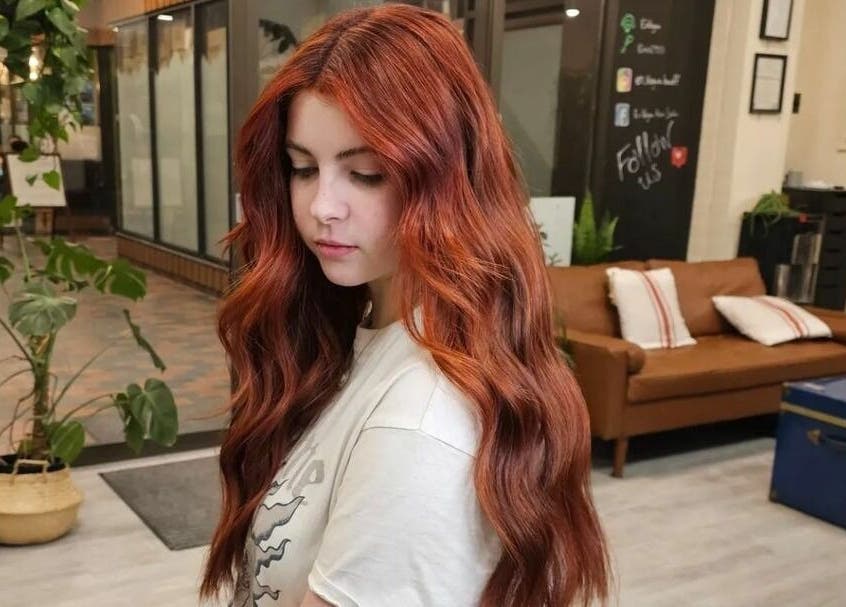 Stylish red hair waves at En Vogue Banff Salon, Banff, Alberta, CA. Luxurious salon interior.