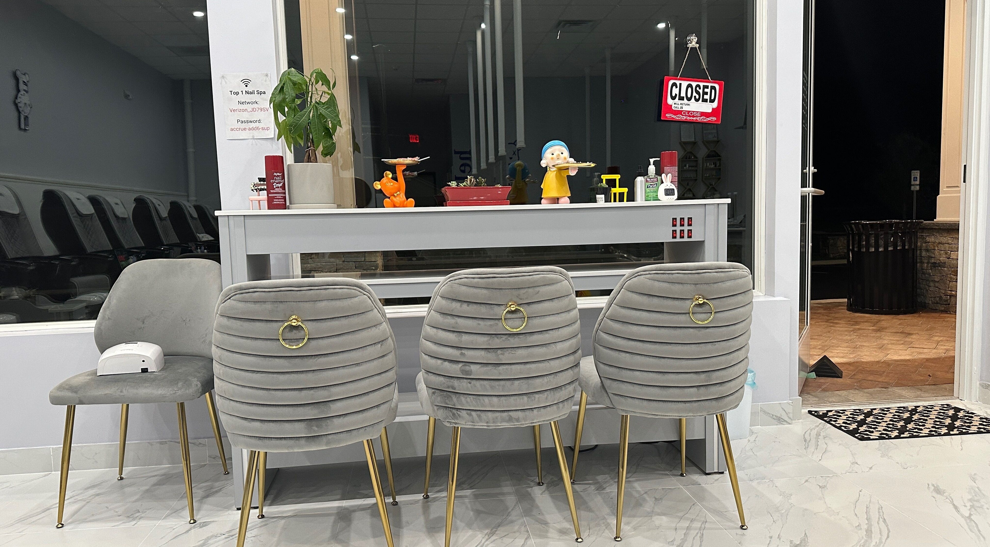Chic seating area at Top 1 Nail Spa, Thornwood, New York, US showcasing stylish chairs and decor.