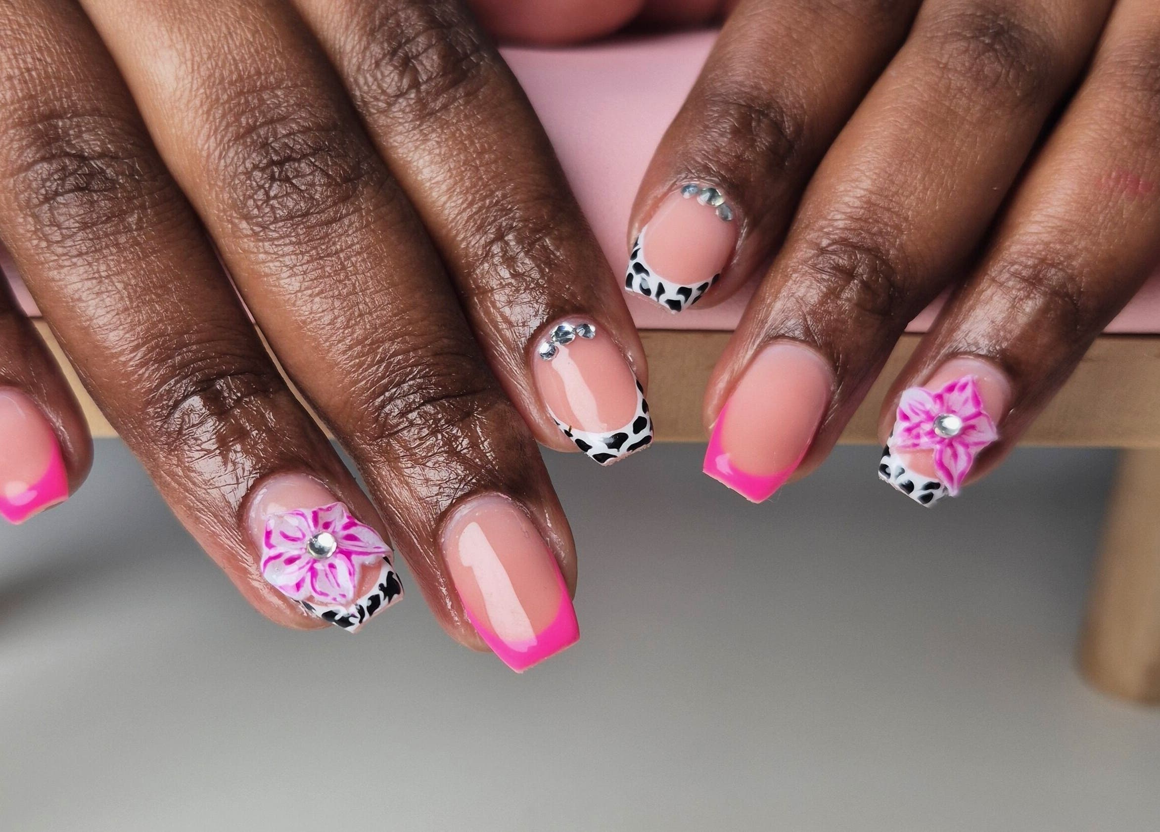 Vibrant nail art with pink tips at Aura Beauty, Westville, Kwazulu-natal, ZA.