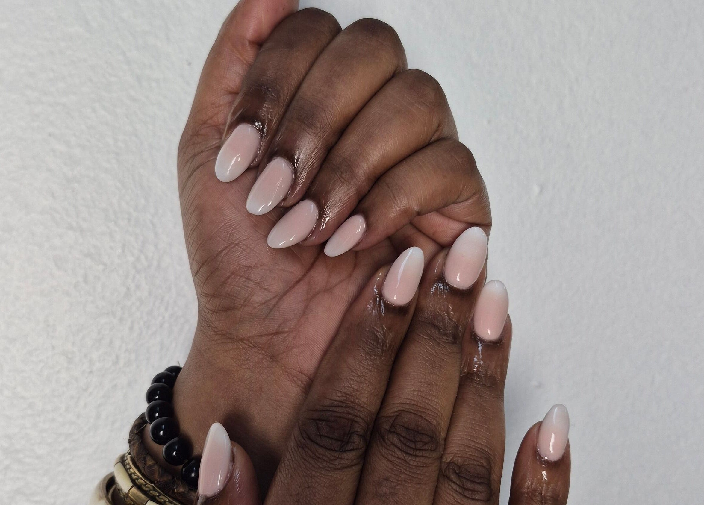 Elegant nude manicure at Aura Beauty, Westville, Kwazulu-natal, ZA, showcasing flawless nail art.