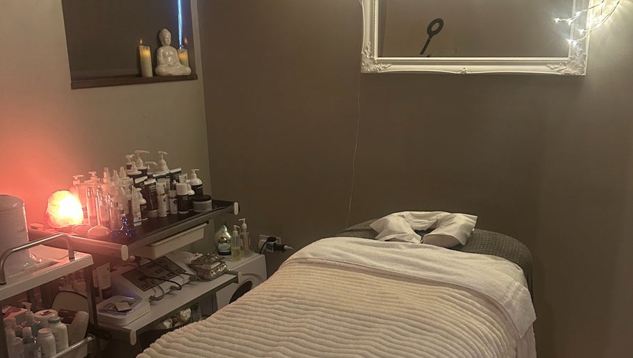Relaxing therapy room at The Ivy Rooms, Dunmow, England, GB with a massage table and calming decor.