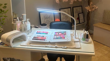 Nail station at The Ivy Rooms, Dunmow, England, GB with polish display and manicure tools.