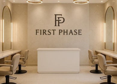 Elegant beauty salon interior at First Phase, Orlando, Florida, US, showcasing stylish mirrors and salon chairs.