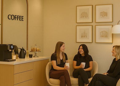 Relaxing coffee corner at First Phase in Orlando, Florida, US, with three women enjoying drinks.