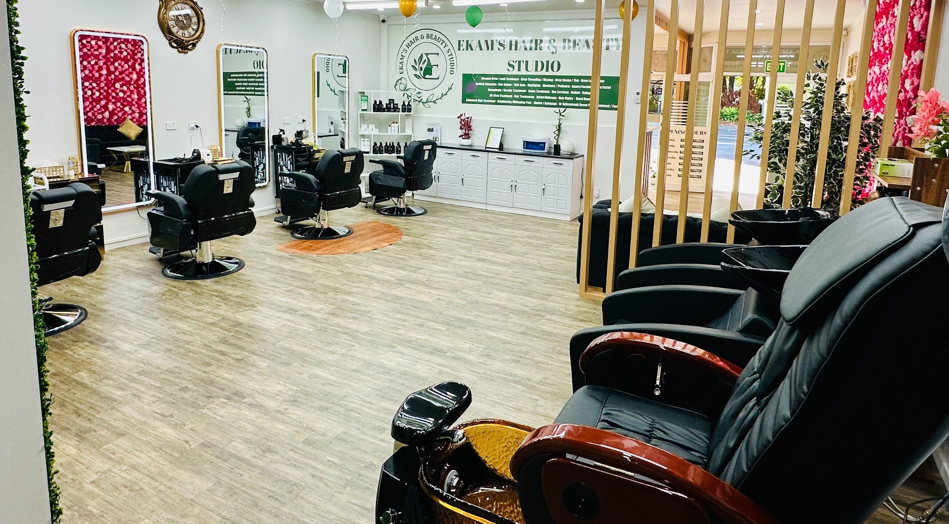 Interior of Ekam’s Hair & Beauty Studio in Auckland, NZ featuring stylish chairs and elegant decor.