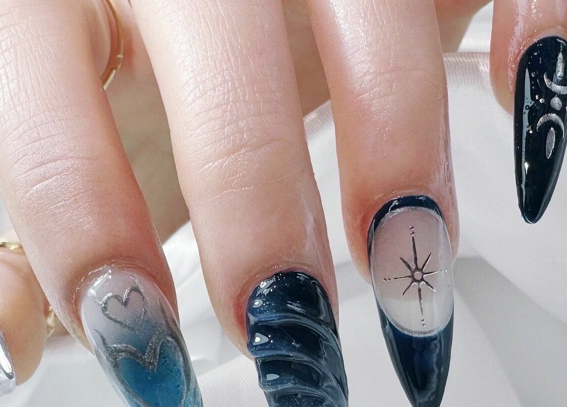 Elegant cosmic nail design at Cosmo Nails & Beauty, Auckland, Auckland, NZ featuring intricate celestial elements.