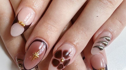 Elegant nail art design at Five Star Nails Mission Bay, Auckland, Auckland, NZ featuring floral and gold accents.