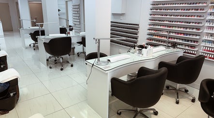 Chic salon at Five Star Nails Mission Bay, Auckland, NZ, with modern nail stations and polish display.