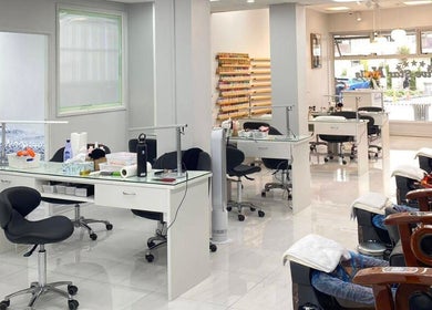 Modern interior of Five Star Nails Mission Bay in Auckland, Auckland, NZ with stylish chairs and nail stations.