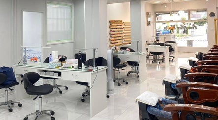 Modern interior of Five Star Nails Mission Bay in Auckland, Auckland, NZ with stylish chairs and nail stations.