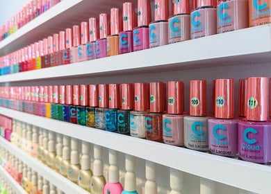 Nail polish collection at Five Star Nails Mission Bay, Auckland, NZ showcasing various vibrant colors.