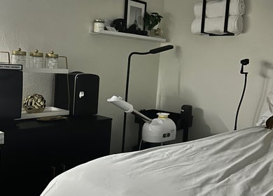 Elegant treatment room at Modest Skin in San Diego, California, US, featuring serene decor and modern equipment.