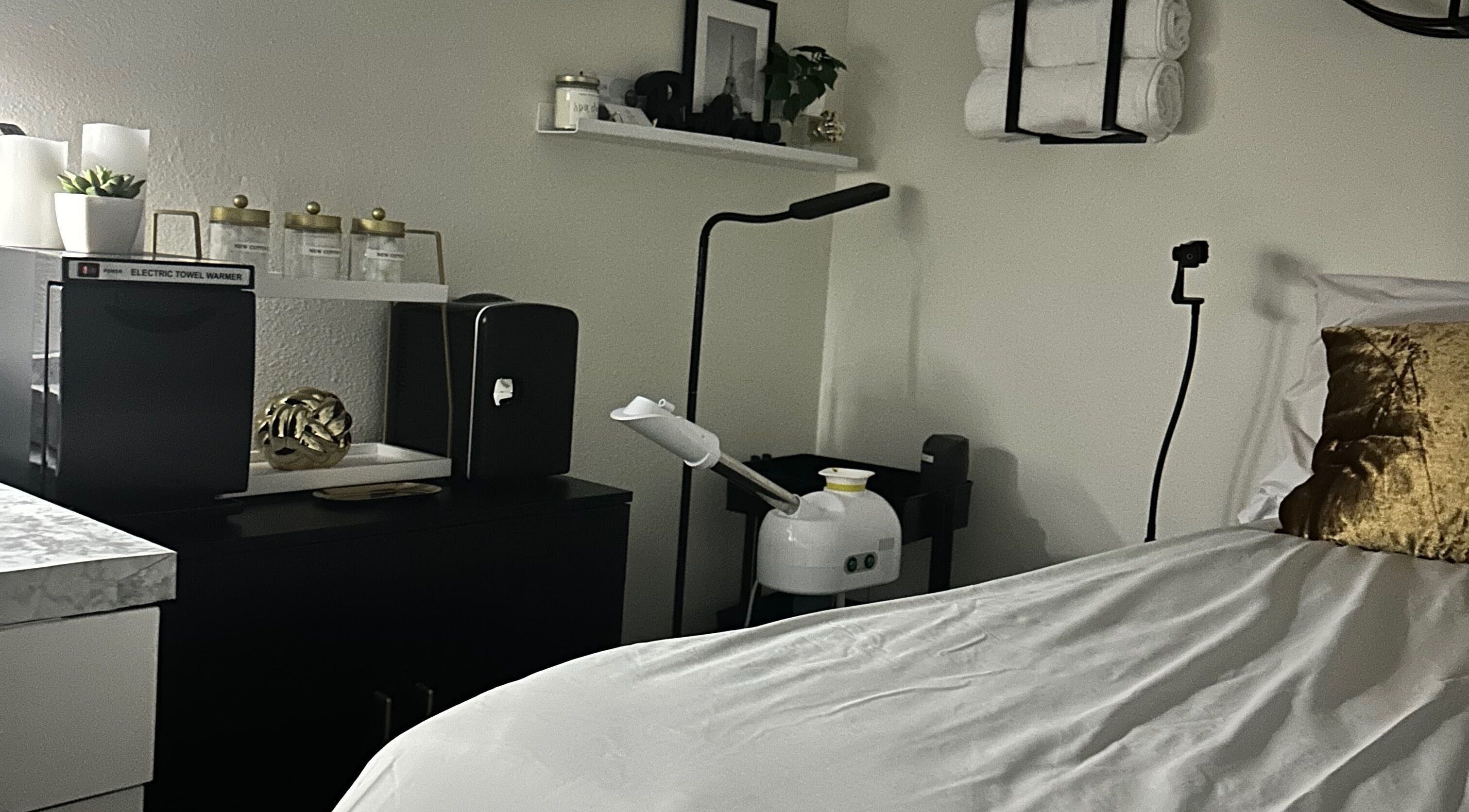 Elegant treatment room at Modest Skin in San Diego, California, US, featuring serene decor and modern equipment.