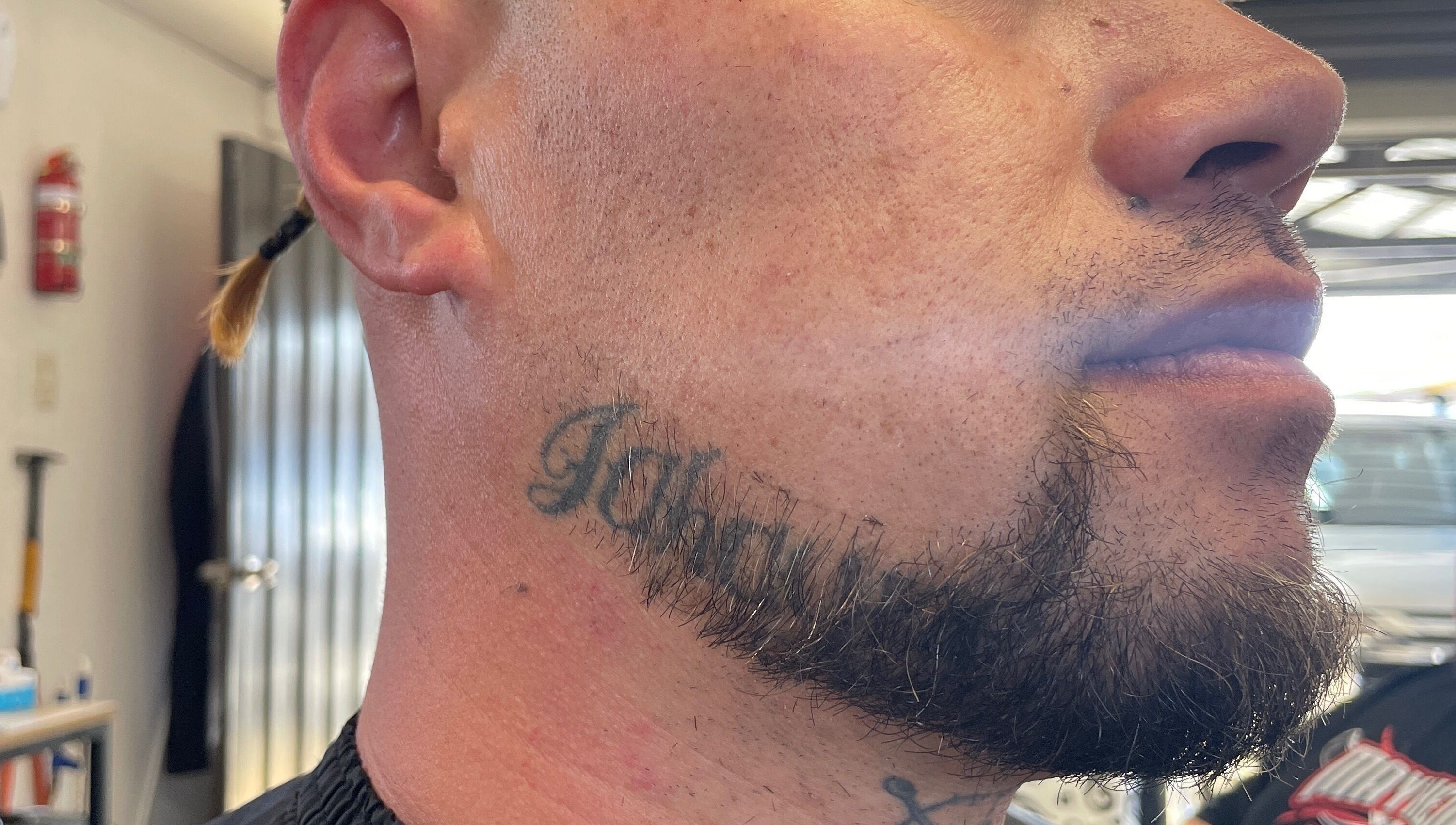 Close-up of a styled beard and neck tattoo at Itz.zaekutz03, Whanganui, Manawatū-whanganui Region, NZ.