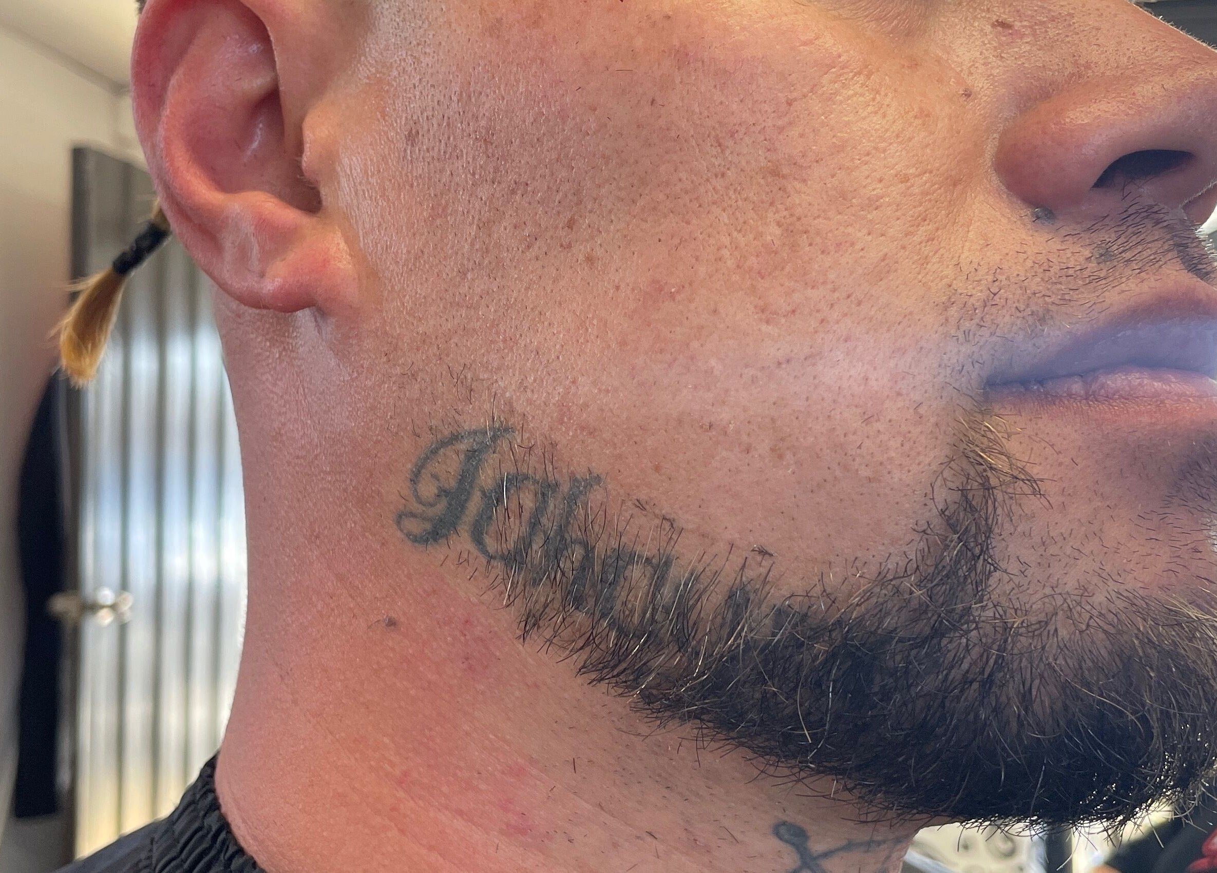 Close-up of a styled beard and neck tattoo at Itz.zaekutz03, Whanganui, Manawatū-whanganui Region, NZ.