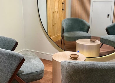 Cozy seating area at Lift Your Soul Head Spa in Stuart Park, Northern Territory, AU with modern chairs and mirror.