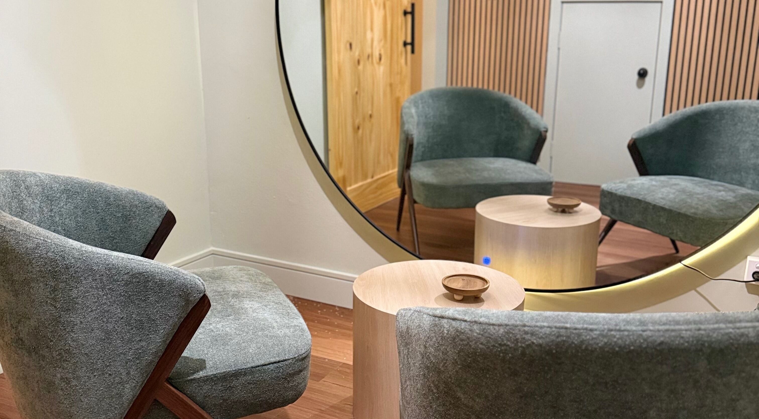 Cozy seating area at Lift Your Soul Head Spa in Stuart Park, Northern Territory, AU with modern chairs and mirror.