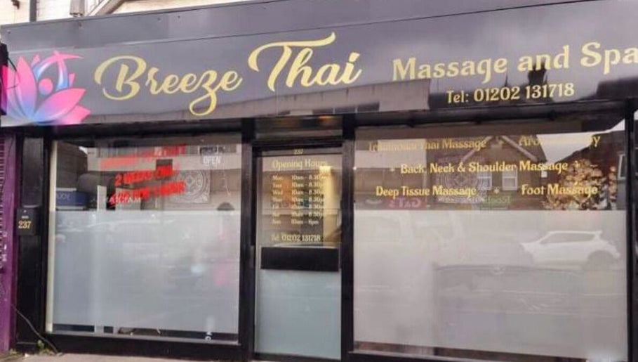 Front view of Breeze Thai Massage & Spa in Poole, England, GB with glass storefront and floral logo.